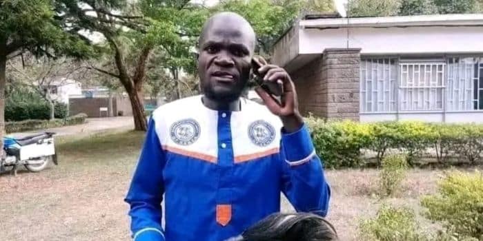 Azimio supporter Nuru Okanga speaks on phone during a past political function.