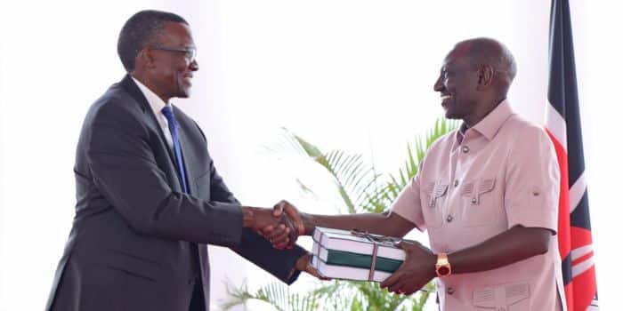 President William Ruitpo (right) receives the final police reforms report from former Chief Justice David Maraga on November 16, 2023.