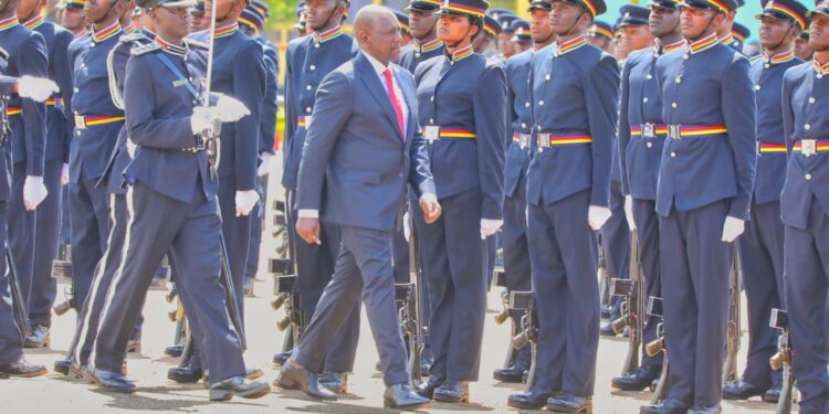President William Ruto inspects a guard of honour mounted by police officers during a past pass out ceremony.
