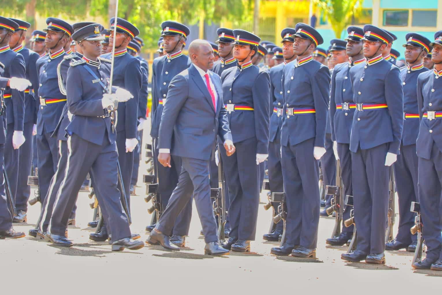 President William Ruto inspects a guard of honour mounted by police officers during a past pass out ceremony.