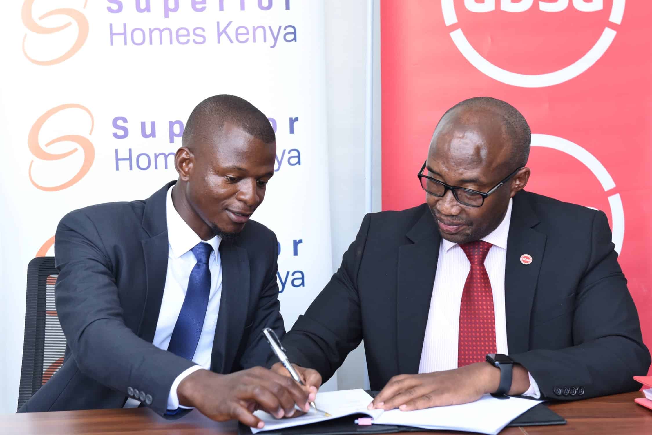 Superior Homes Kenya Head of Sales Clive Ndege and Absa Bank Regional Manager and Head of Mortgage Retail and Business Banking John Kaburu sign a mortgage financing deal