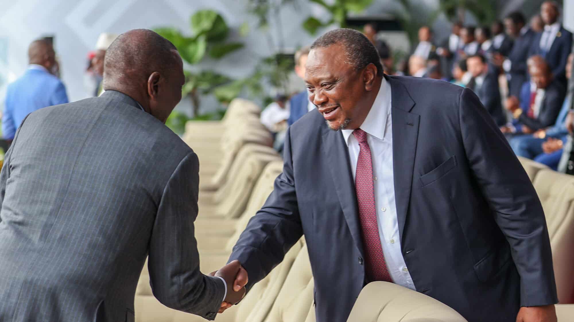 President William Ruto shakes hands with his predecessor Uhuru Kenyatta during the swearing in of DRC President Félix Antoine Tshisekedi Tshilombo. Rigathi Gachagua