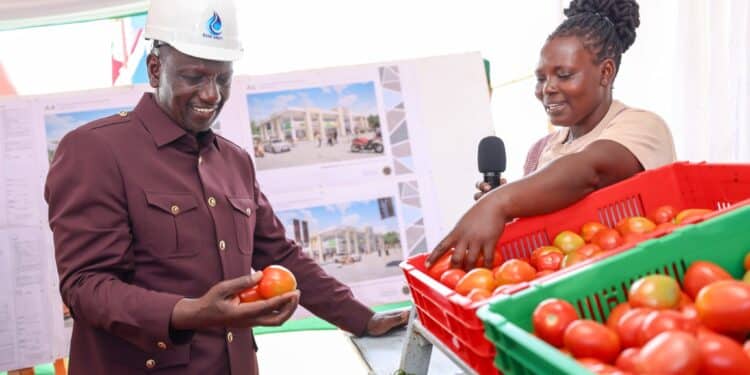 President William Ruto with a trader in Meru. PHOTO/PCS.