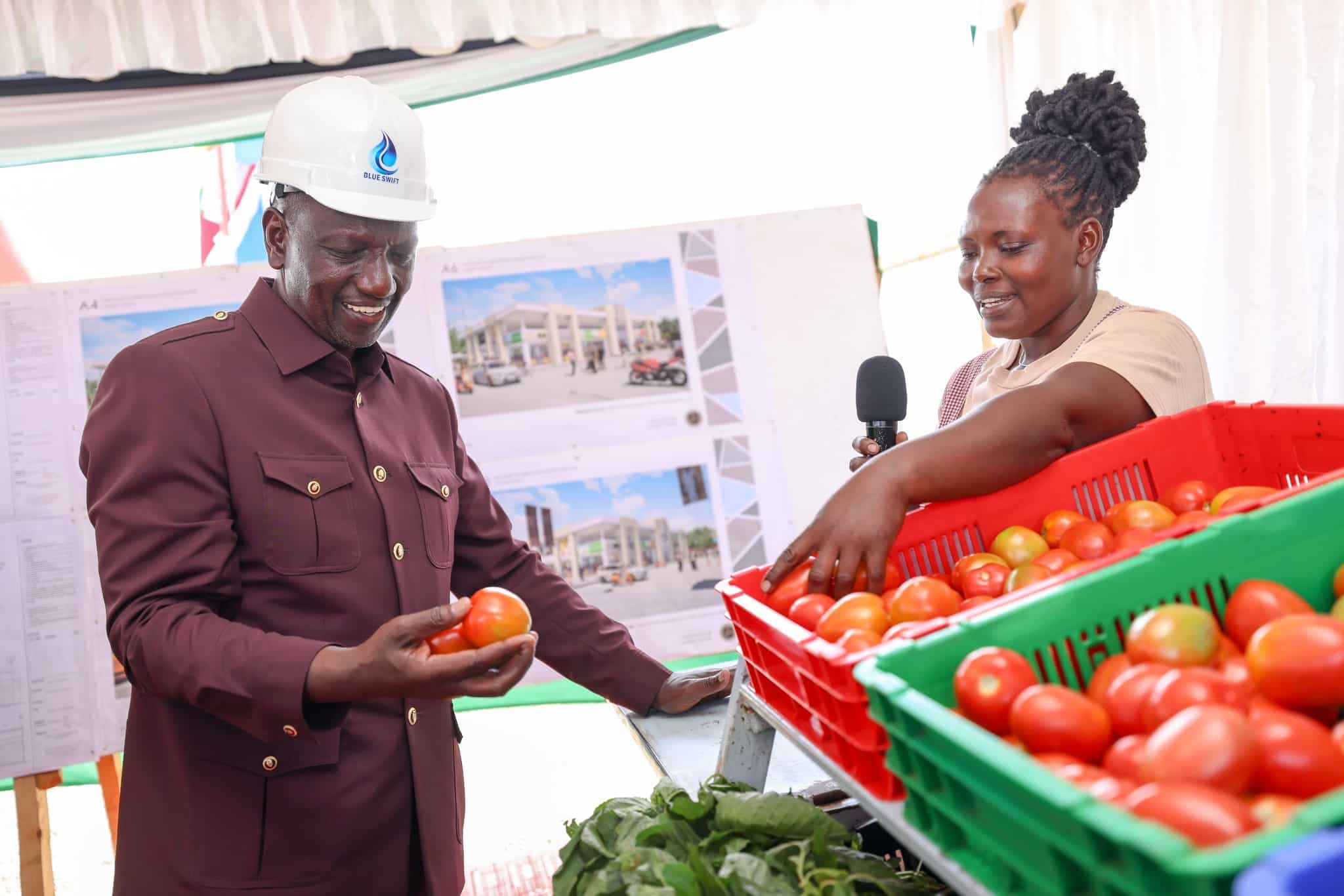 President William Ruto with a trader in Meru. PHOTO/PCS.