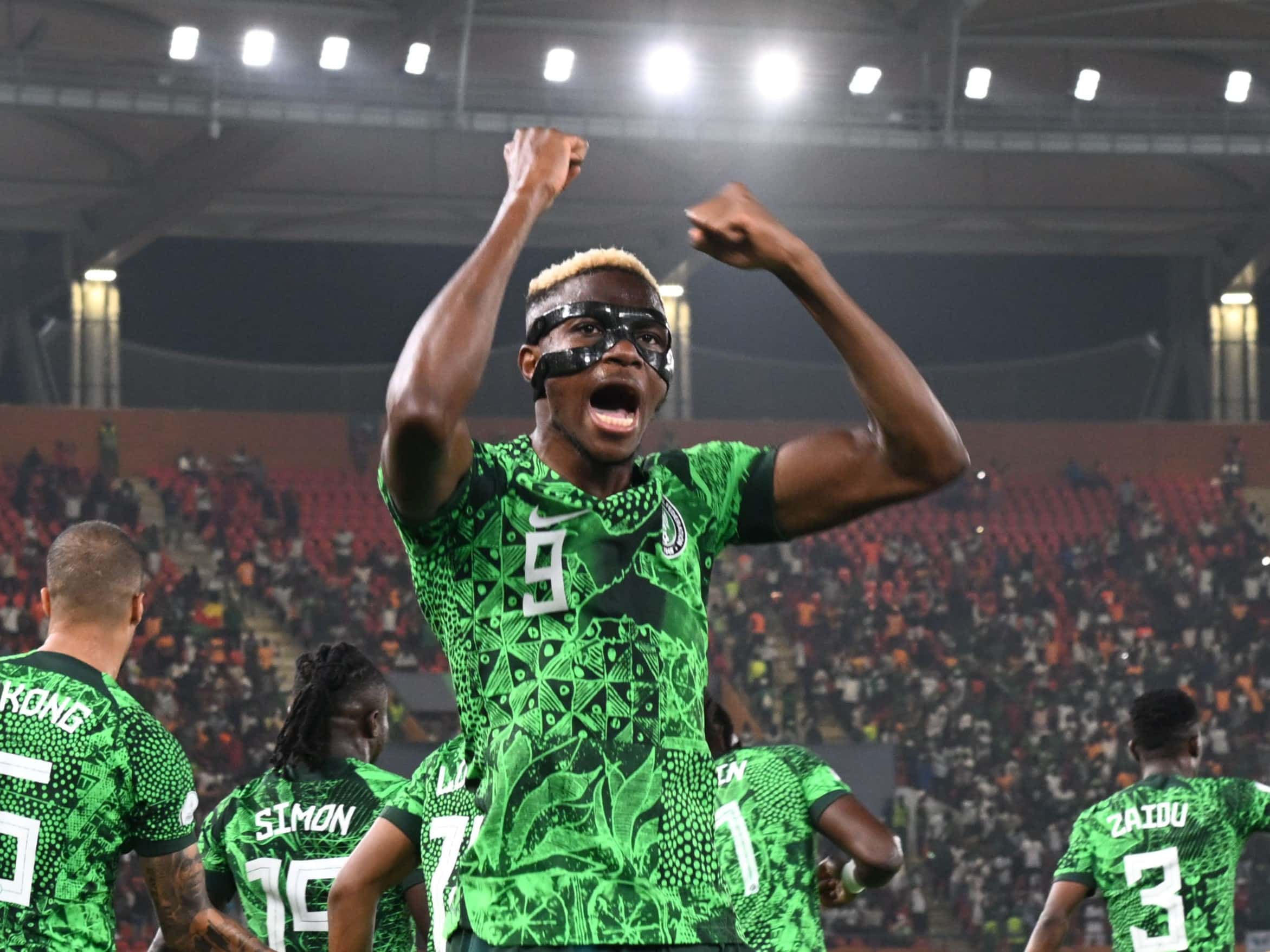 Nigeria Striker, Victor Osimhen wearing a face mask celebrating a 2-0 win against Cameroon.
