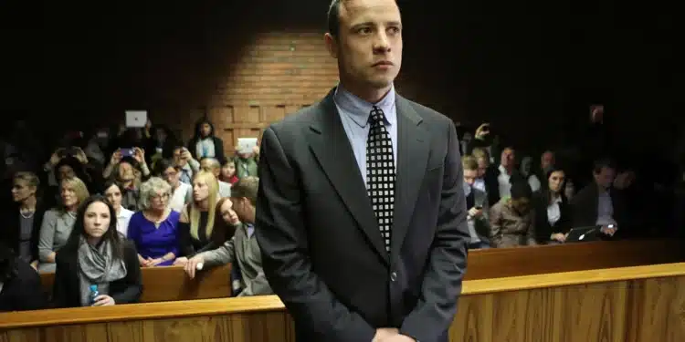 Oscar Pistorius enters the dock before court proceedings at the Pretoria Magistrates court June 4, 2013. PHOTO/Courtesy
