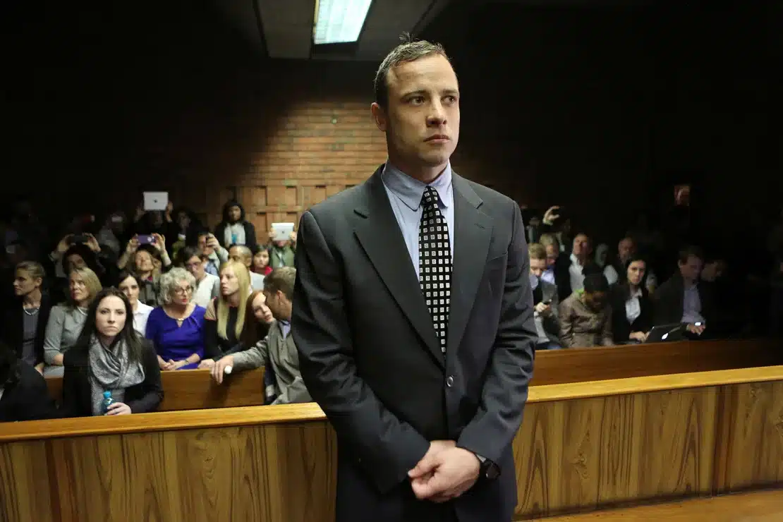 Oscar Pistorius enters the dock before court proceedings at the Pretoria Magistrates court June 4, 2013. PHOTO/Courtesy