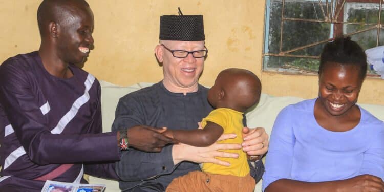 Government Spokesperson Dr Isaac Mwaura carrying his namesake. PHOTO/ Mwaura X.