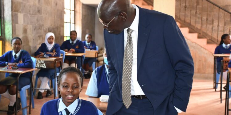 PS for Basic Education Dr Belio Kipsang peps up a section of KCSE candidates at Moi Girls High School in Nairobi in 2023. PHOTO/Courtesy