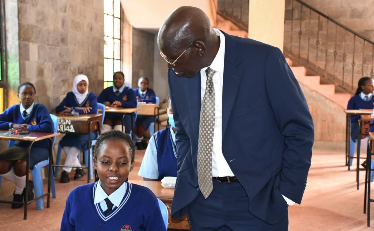 PS for Basic Education Dr Belio Kipsang peps up a section of KCSE candidates at Moi Girls High School in Nairobi in 2023. PHOTO/Courtesy