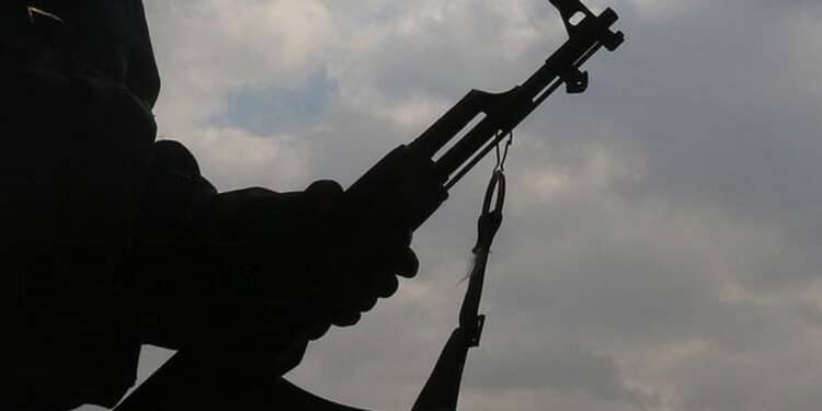 An image of a man holding a gun. PHOTO/ Pexels