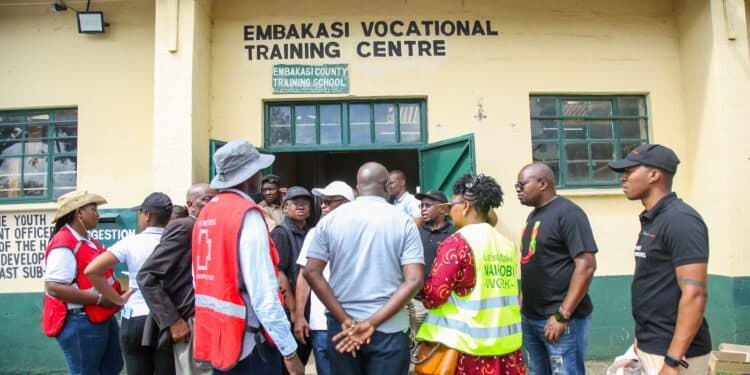 Kenya Red Cross official during the distributions of donations to affected Embakasi families
