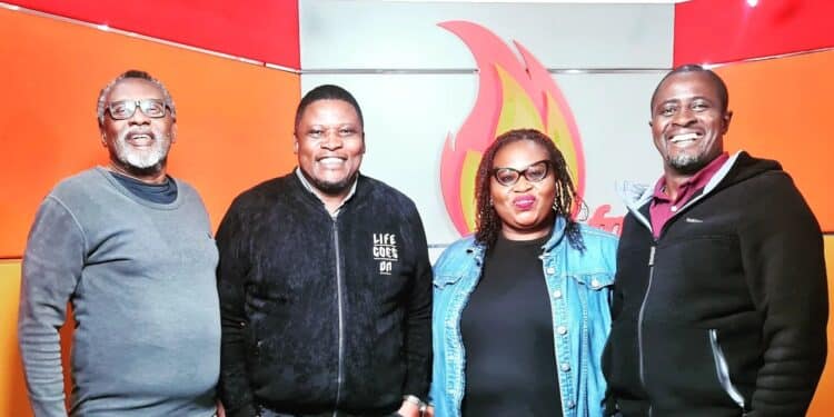 Tom Japanni 9second from left) poses for a photo with Spice FM's CT Muga, (left), Eric Latiff (right), and Ndu Okoh.