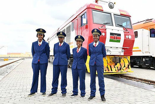 Kenya Railways coorporation staff pause alongside a train. PHOTO/Kenya Railways Corporation.