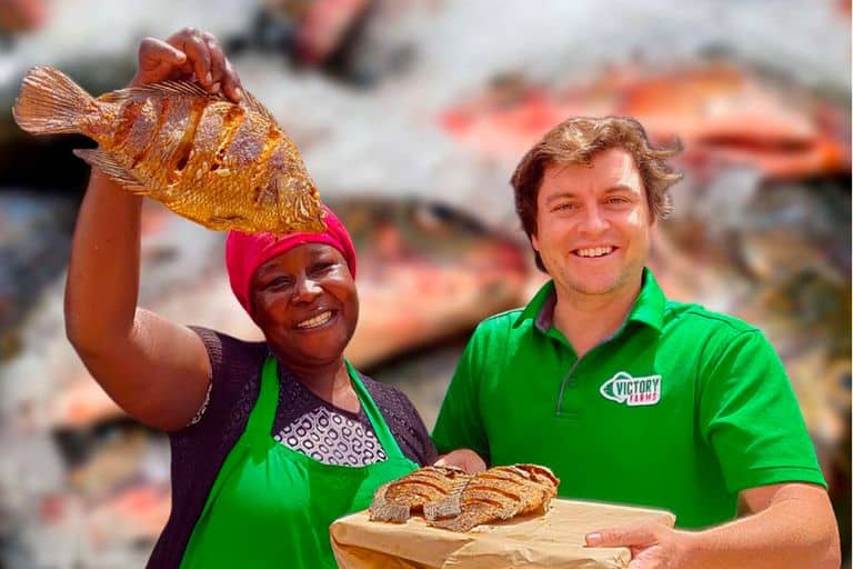 Maureen Adhiambo(L), fish trader at Nairobi West and Joseph Rehmann, founder of Victory Farm in Homa Bay County.