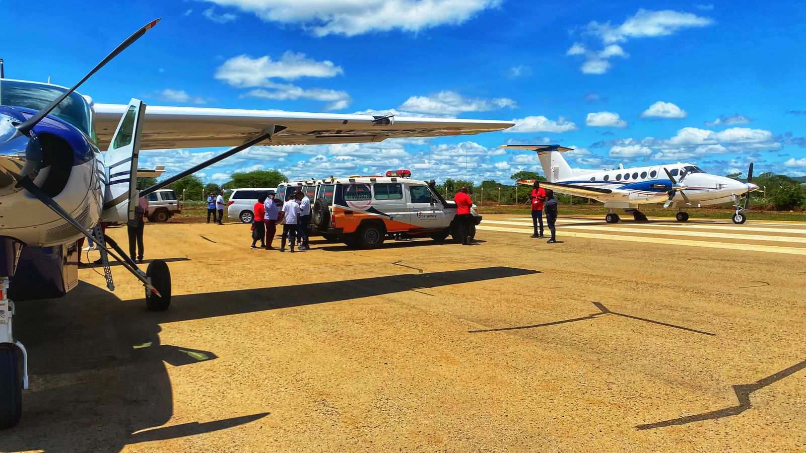 Paramedics from the Kenya Redcross and AMREF prepare to airlift survivors of the KU bus crash to Nairobi for treatment on Tuesday, March 19.