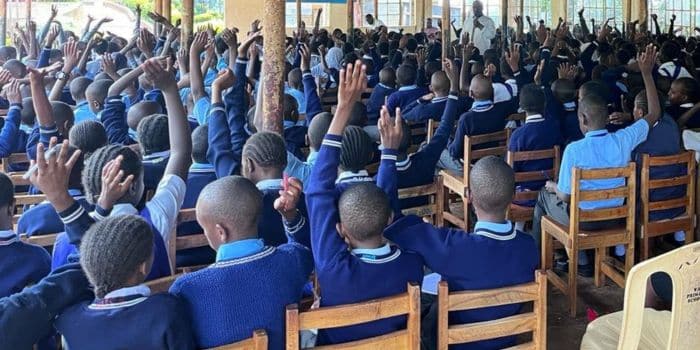 Primary school students with teachers. Primary school students at a past event.Primary school students at a past event.