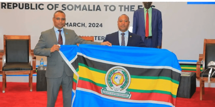 Somalia's Minister of Commerce Jibril Abdirashid Haji Abdi (left) with EAC Secretary General, Dr Peter Mathuki (right). PHOTO/EAC.