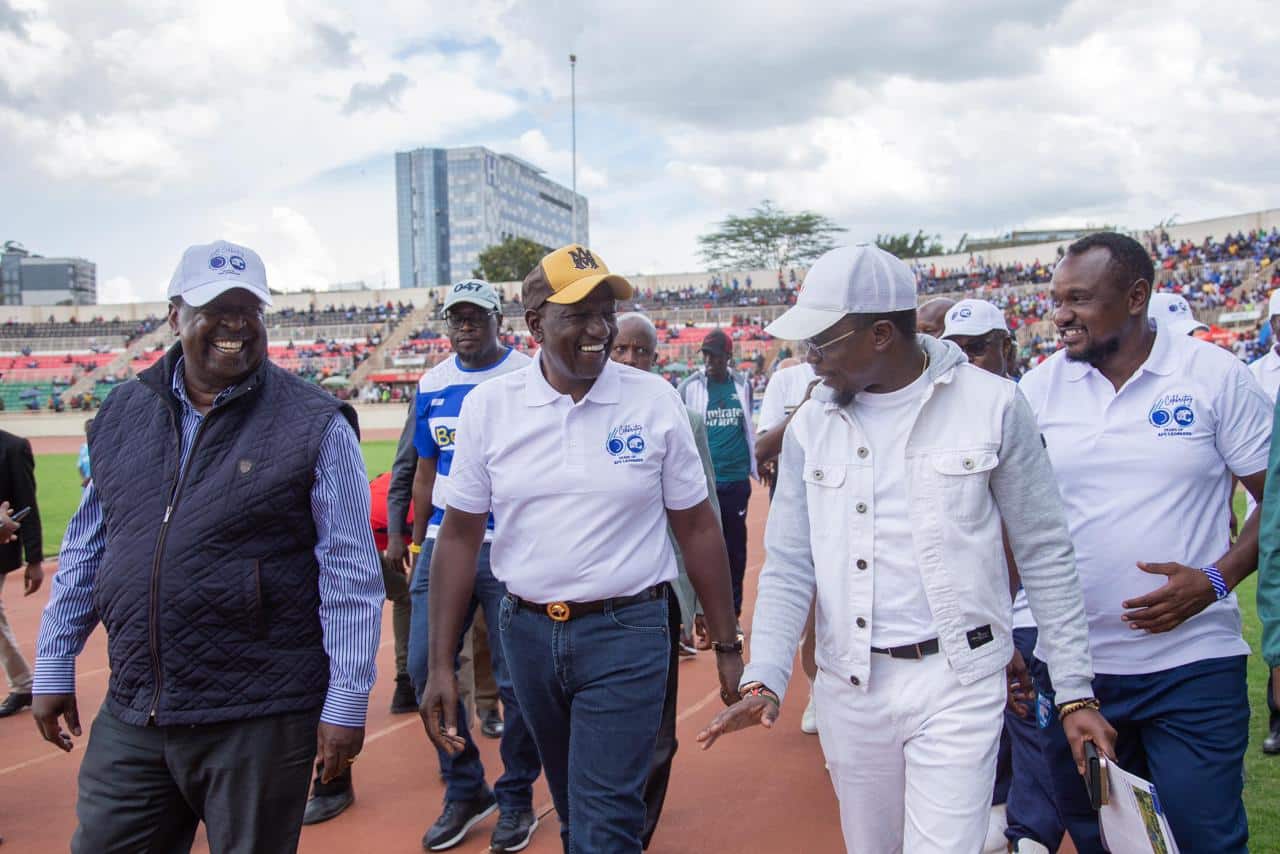 Sports Cabinet Secretary Ababu Namwamba (second from right) and President William Ruto (center0 arrive at the Nyayo Stadium on March 24, 2024.