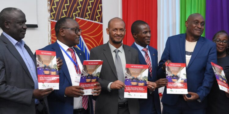 Dr. Moses Kiarie (Centre) from the Deputy Director Quality Assurance, Ministry of Education, with Mandera South MP Abdul Haro (Right) launches the Usawa Agenda SESS 2024 Report) at KICD, Nairobi, on Wednesday April 24, 2024.