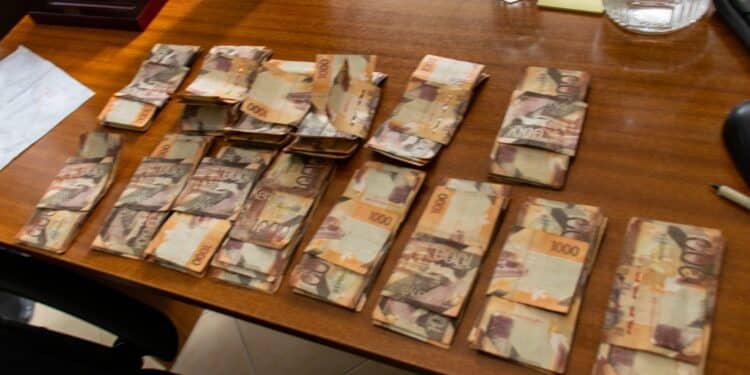 The money EACC detectives recovered at the suspect's house. PHOTO/EACC.