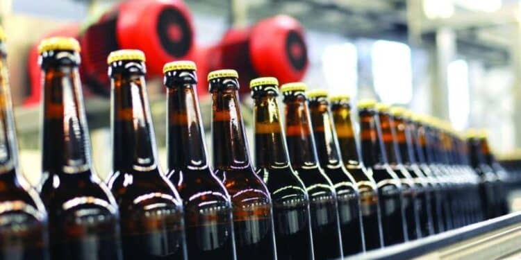 Beer Bottles On An Assembly Line. Photo/Courtesy