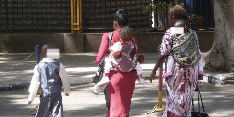 Photo of mothers carrying children