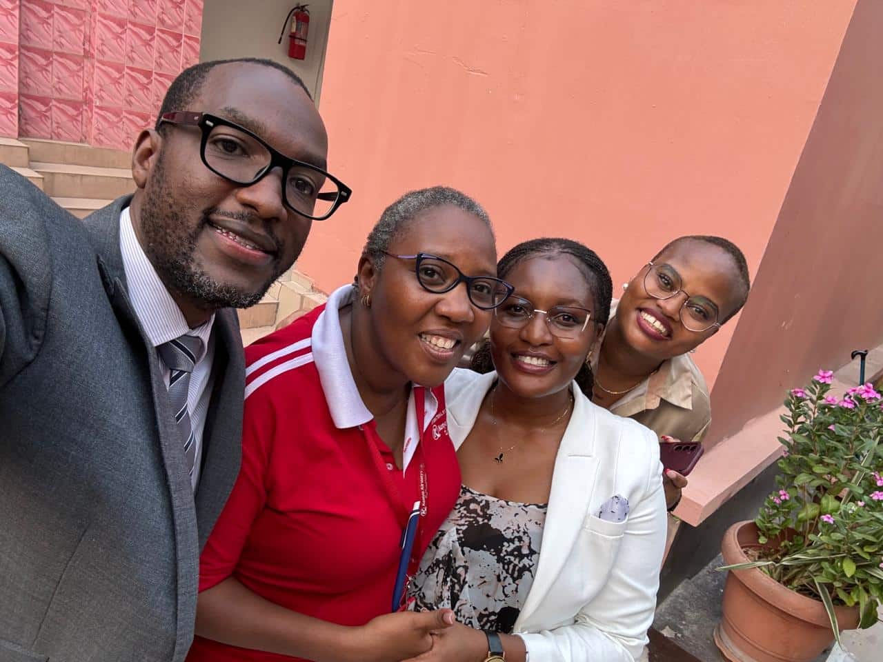 Officials pose for a photo after the release of Lydia Mbotela, a Kenya Airways staffer who detained in the DRC.