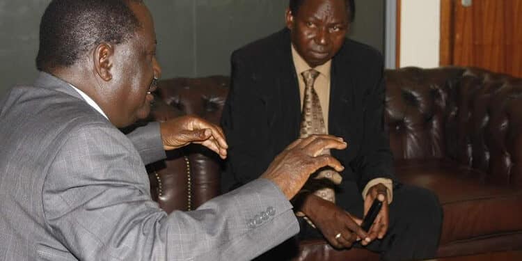 Opposition leader Raila Odinga and EX Magarini MP Harrison Garama Kombe. PHOTO/Courtesy