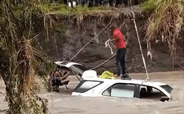 The body of Chief Inspector Cyprian Walunya Kasil being retrieved from River Kware. PHOTO/Screengrab