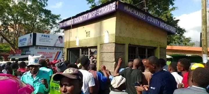 Onlookers surrounding the crime scene in Machakos County where the man committed suicide. PHOTO/UGC