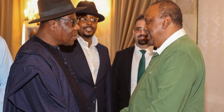 Former President Uhuru Kenyatta (in green polo T-shirt) in Nigeria. PHOTO/4th President of Kenya.