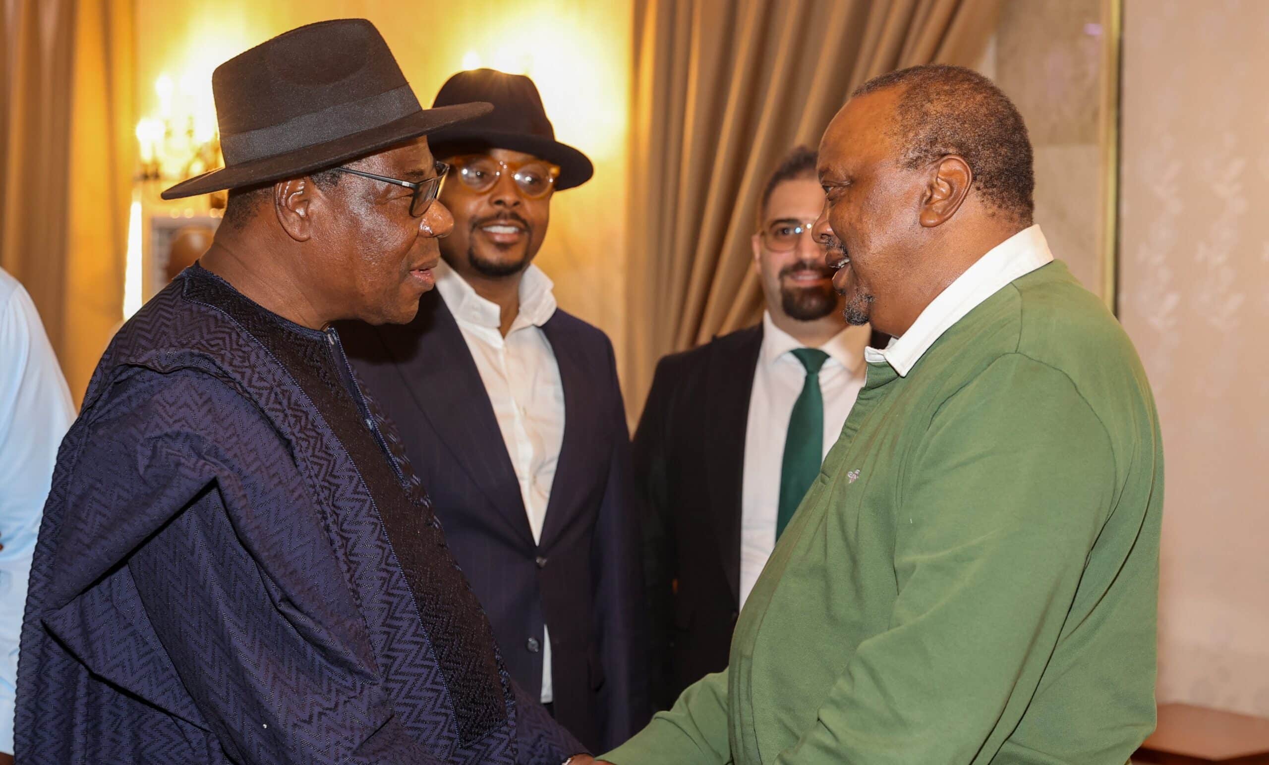 Former President Uhuru Kenyatta (in green polo T-shirt) in Nigeria. PHOTO/4th President of Kenya.