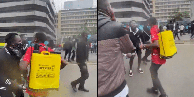 A protestor using Knapsack sprayer to help teargassed protesters in Nairobi CBD. Photo/TKT