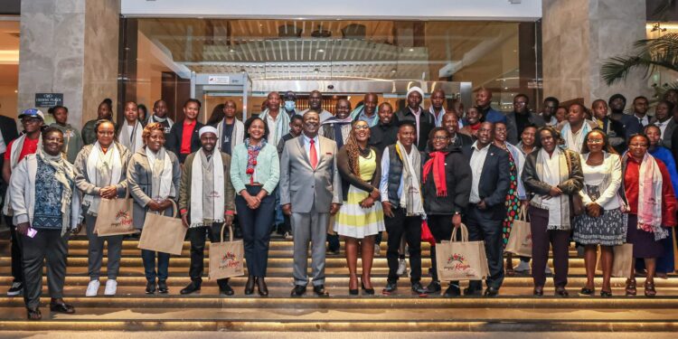 Prime CS Musalia Mudavadi pose for a photo with the first group of teachers to secure foreign jobs at JKIA on July 29, 2024. PHOTO/OPCS.