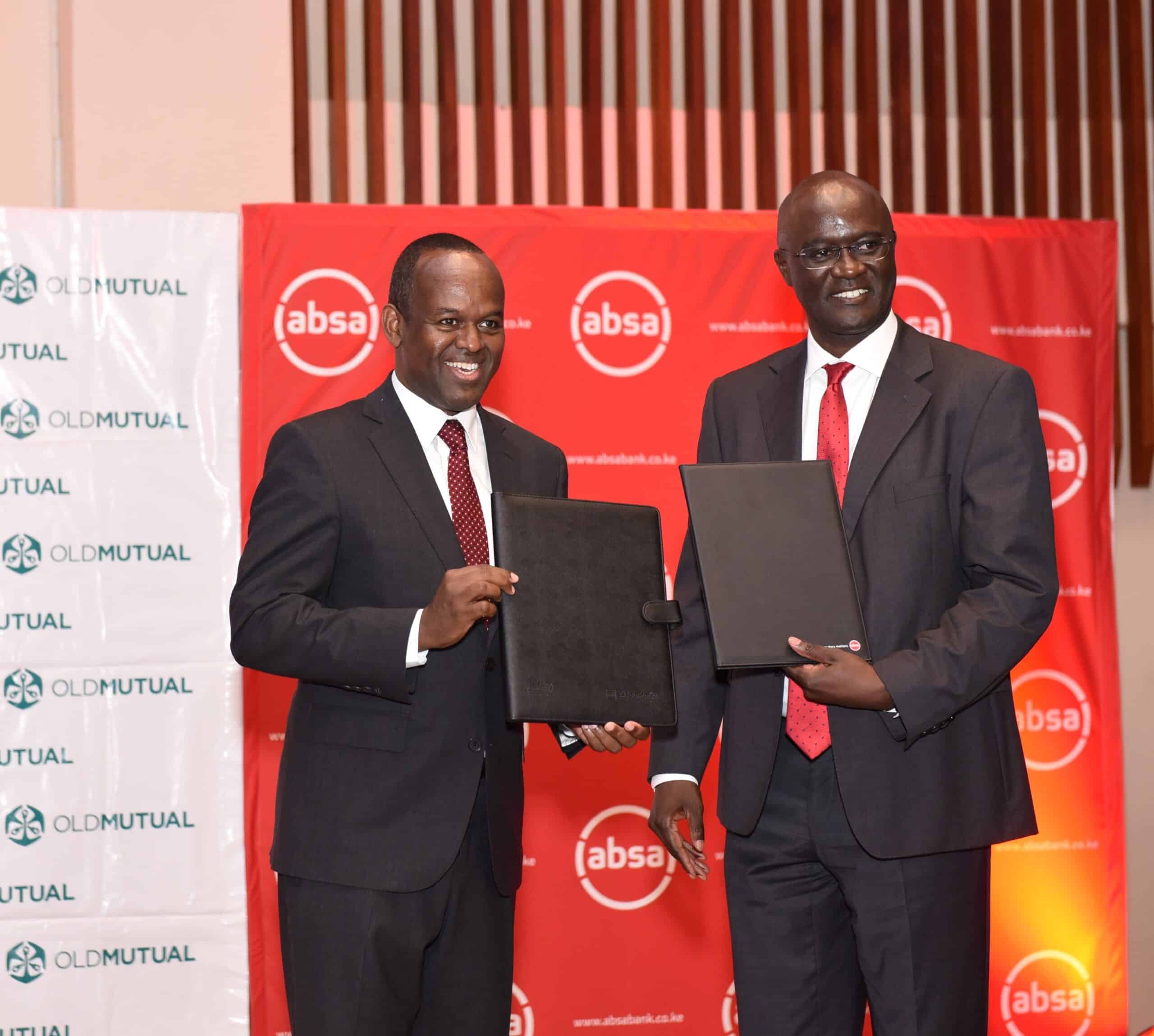 Absa Bank Kenya MD & CEO Abdi Mohamed and Old Mutual East Africa Group CEO Arthur Oginga officially launch the Linda Biz SME bundled insurance solution. PHOTO/ ABSA