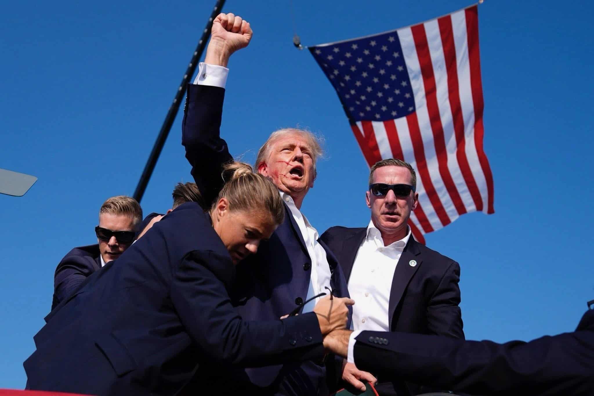 Former U.S President Donald Trump helped by Secret Service after he was shot on Saturday, July 13, 2024. PHOTO/Courtesy.