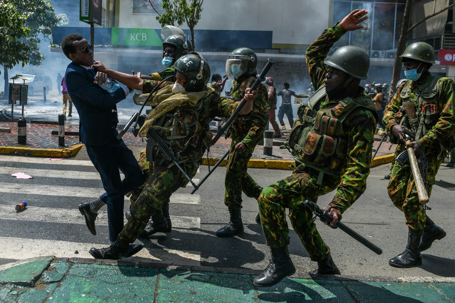Kenyan police officers manhandle a protestor on June 25, 2024. Gerald Anderson/Anadolu via Getty Images