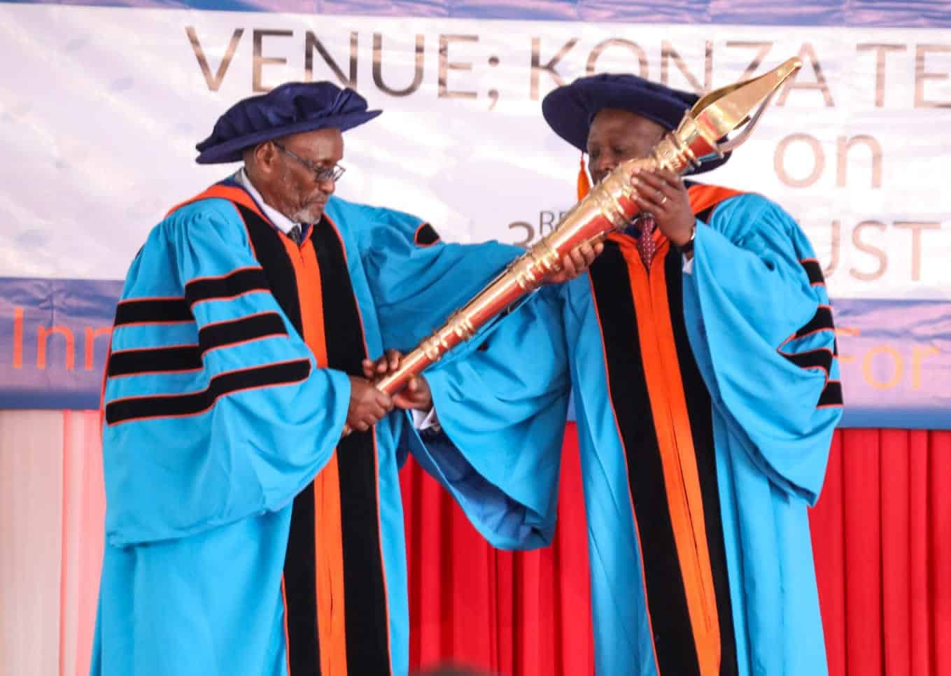 Open University Chancellor James Mwangi (Right) receiving the instrument of power after his appointment. PHOTO/MoE.