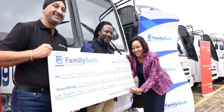 Family Bank CEO Nancy Njau signs a KES. 103 million cheque during the handover of 14 Hino buses financed by the Bank to CFAO Mobility Kenya Group MD Arvinder Reel & Metro Trans Investment Limited Chairman Oscar Omurwa.