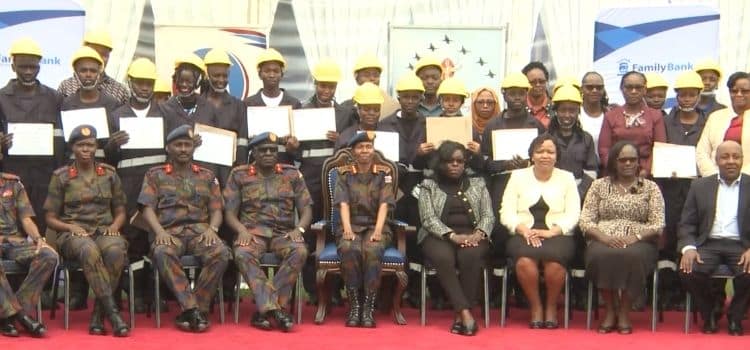 Officials from both the Military Wives Association of Kenya (MWAK) and Family Group Foundation pose for a photo with the beneficiaries of the program. PHOTO/Screengrab.