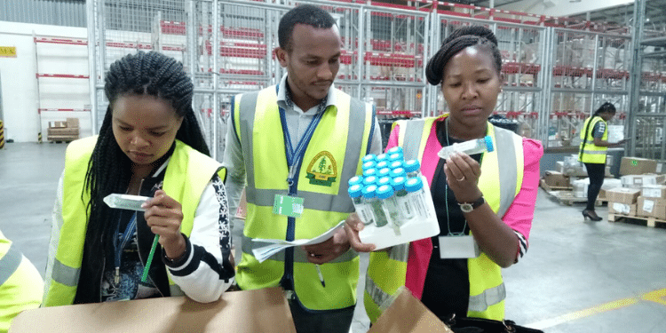 National Biosafety Authority officers inspecting food cargo at the JKIA. photo NBA