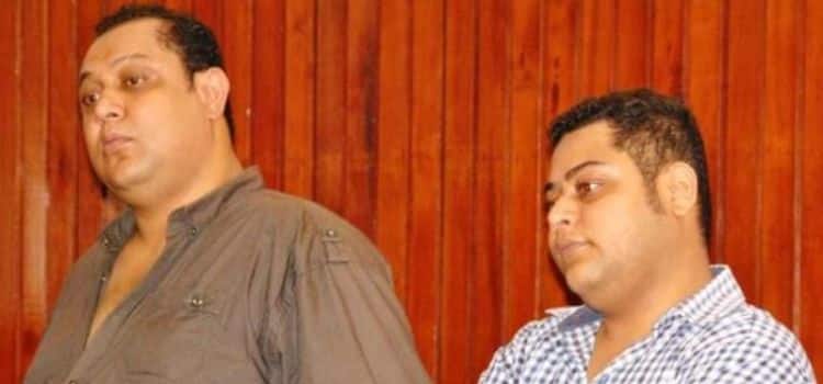 Two brothers, Baktash Akasha (left) and Ibrahim Akasha (right), standing in a courtroom in Mombasa.