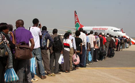 Kenyans queue at Juba Airport in South Sudan on Thursday 02/01/14 to board a KQ plane to evacuate them after the country broke into war. Photo/Boniface Okendo/Standard)