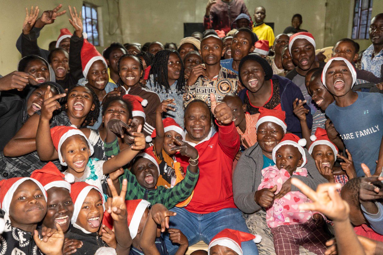 Former Kenya's President Uhuru Kenyatta hosting children in December 2022. PHOTO/State House.