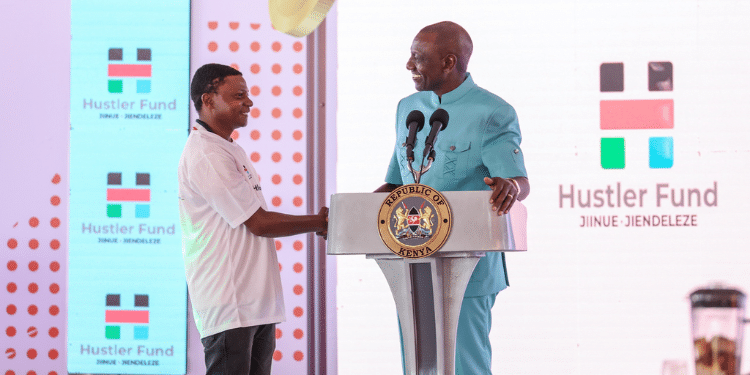 President William Ruto with one of the beneficiaries of Hustler Fund during a past event where he announced raising of the limit for the Fund. Photo/ President Ruto