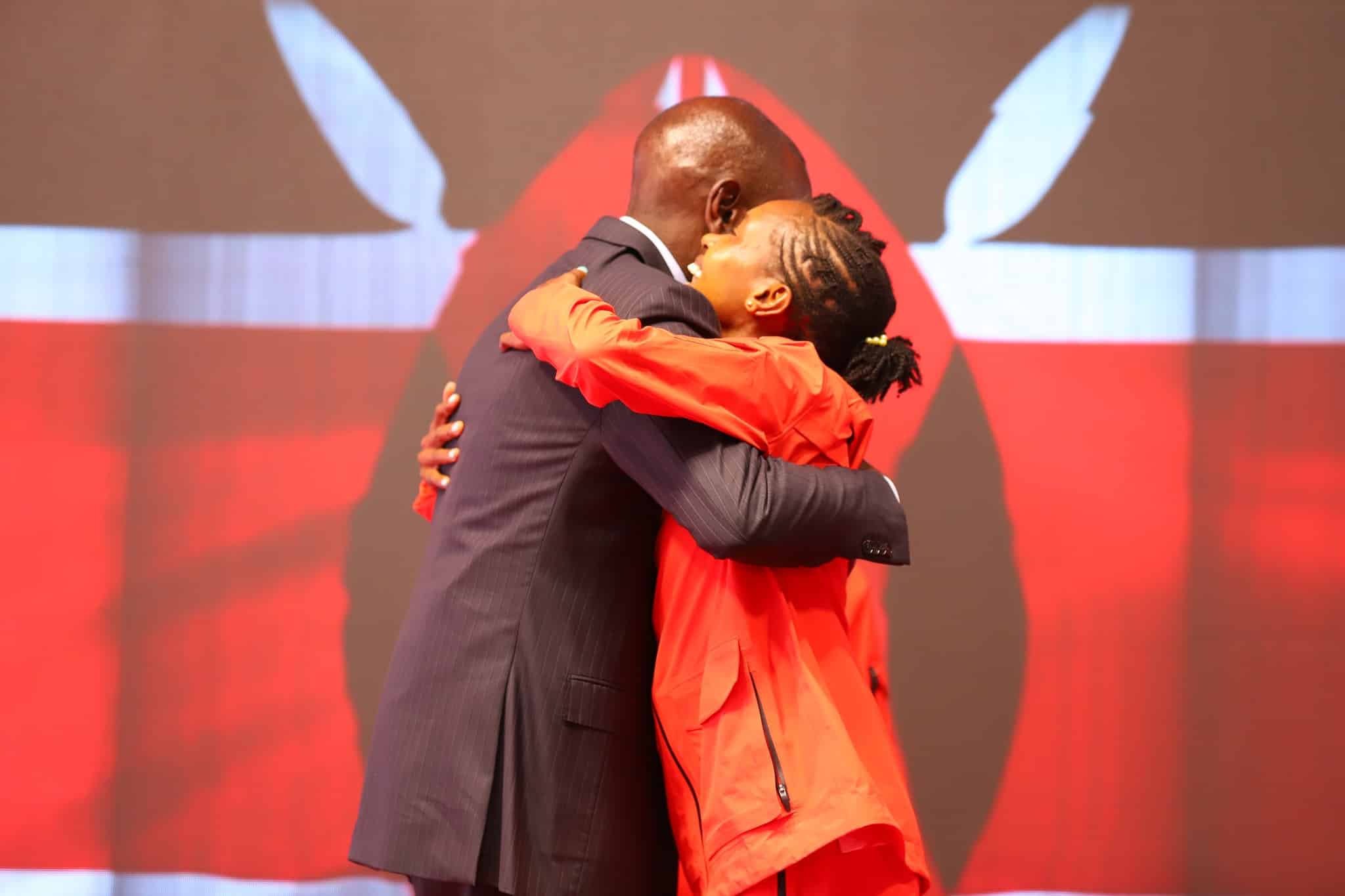 President William Ruto hugs elite athlete Faith Kipyegon during an event at State House. PHOTO/PCS.