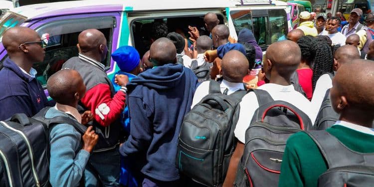 High School students scrambling for a matatu. PHOTO/Nation