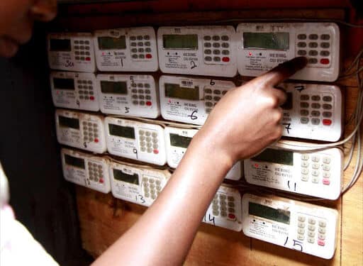 A customer in Loresho, Nairobi, keys in tokens in her meter box. Photo/ KPLC