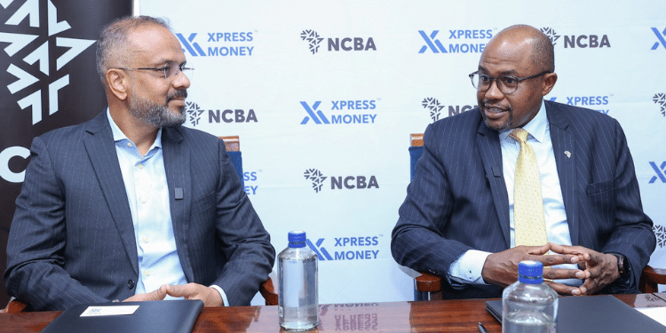 NCBA Group Retail Director, Tirus Mwithiga with Xpress. Money CEO, Samir Vidhate during a memorandum of Understanding signing between NCBA and Xpress Money at NCBA House Nairobi. The MoU will offer a cross border international payment solutions platform that will offer efficient remittance services to diaspora customers. Photo/ NCBA